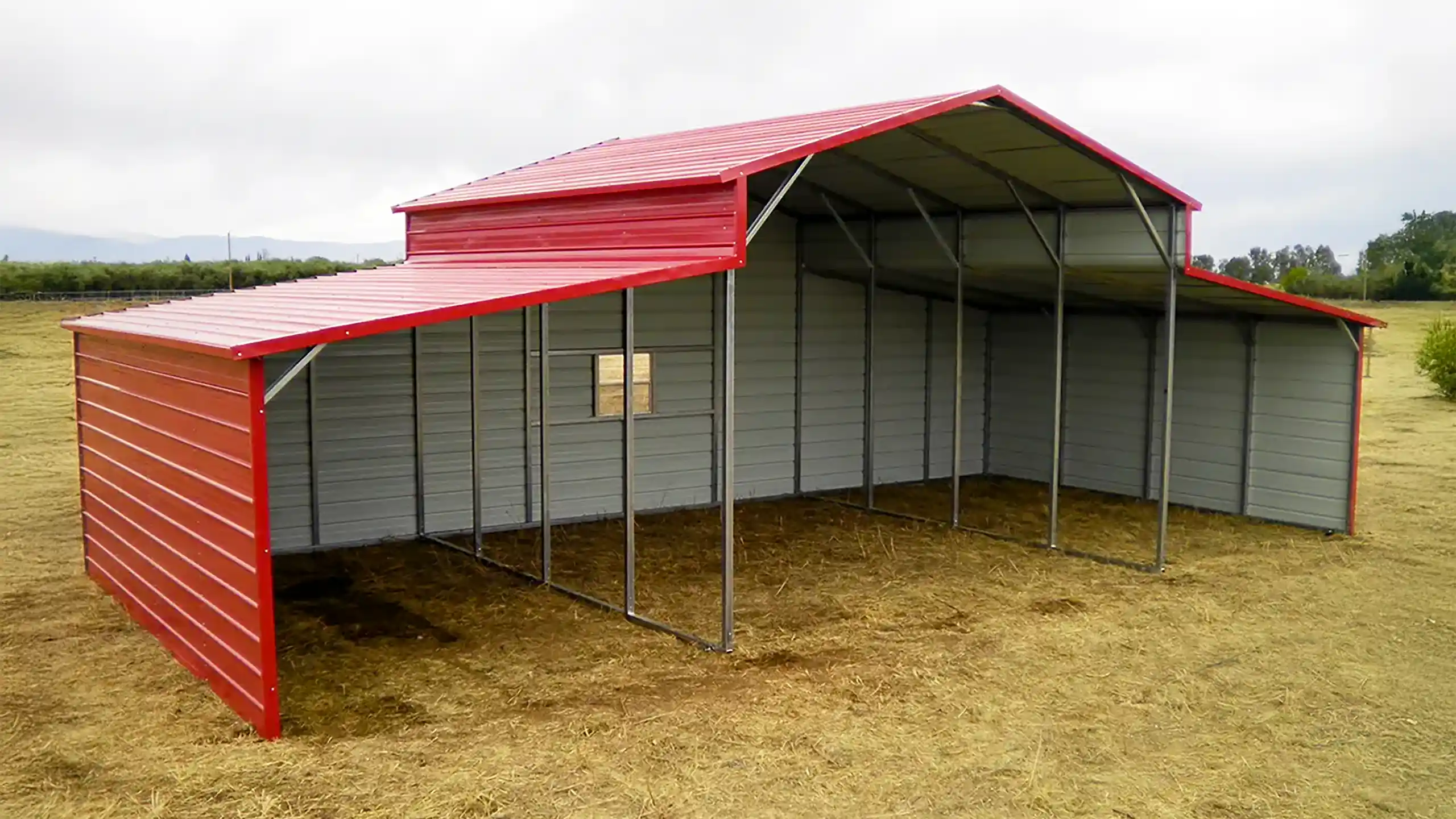 Red open metal hay barn